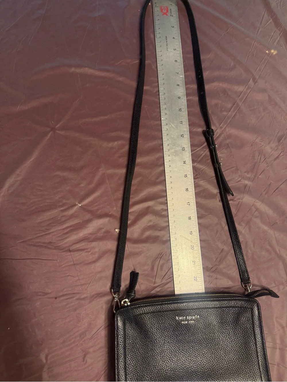 Kate Spade Knott small crossbody clutch in black pebbled leather